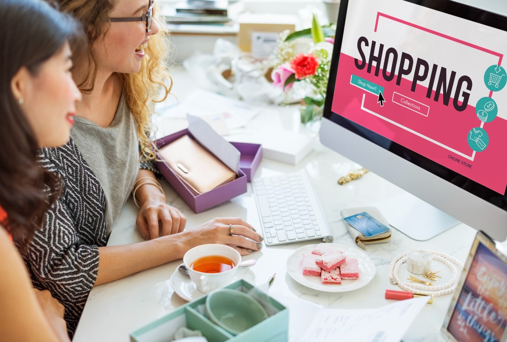 Photo showing two women shopping on a desktop